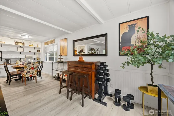 a view of a dining room with furniture and wooden floor