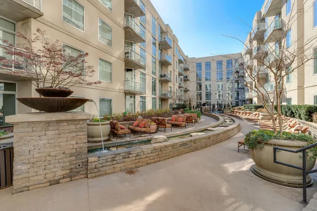 a view of a patio with table and chairs and potted plants