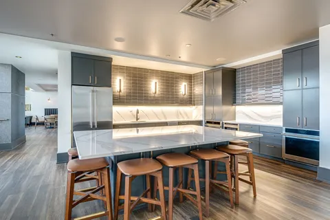 a kitchen with a table and chairs in it