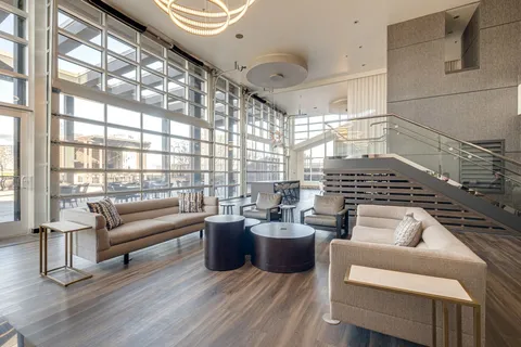 a living room with furniture window and wooden floor