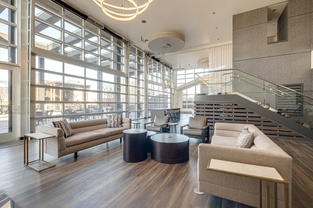 a living room with furniture window and wooden floor