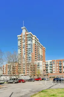 a tall building sitting on the side of a road