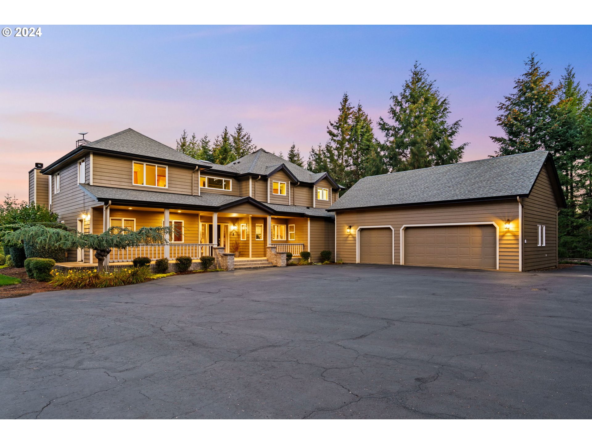 25241 Hall Road Cheshire, OR 97419 - Photo 1 of 48 a front view of a house with a yard and garage