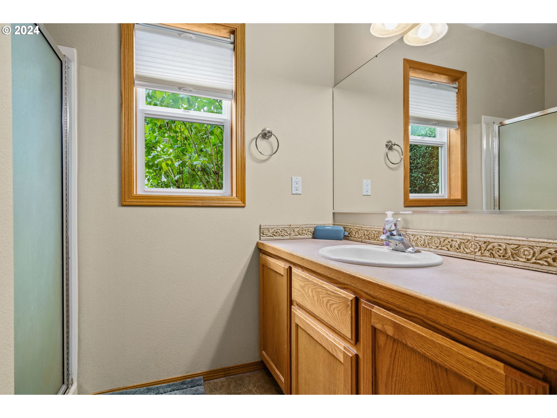 25241 Hall Road Cheshire, OR 97419 - Photo 15 of 48 a bathroom with a sink and a mirror