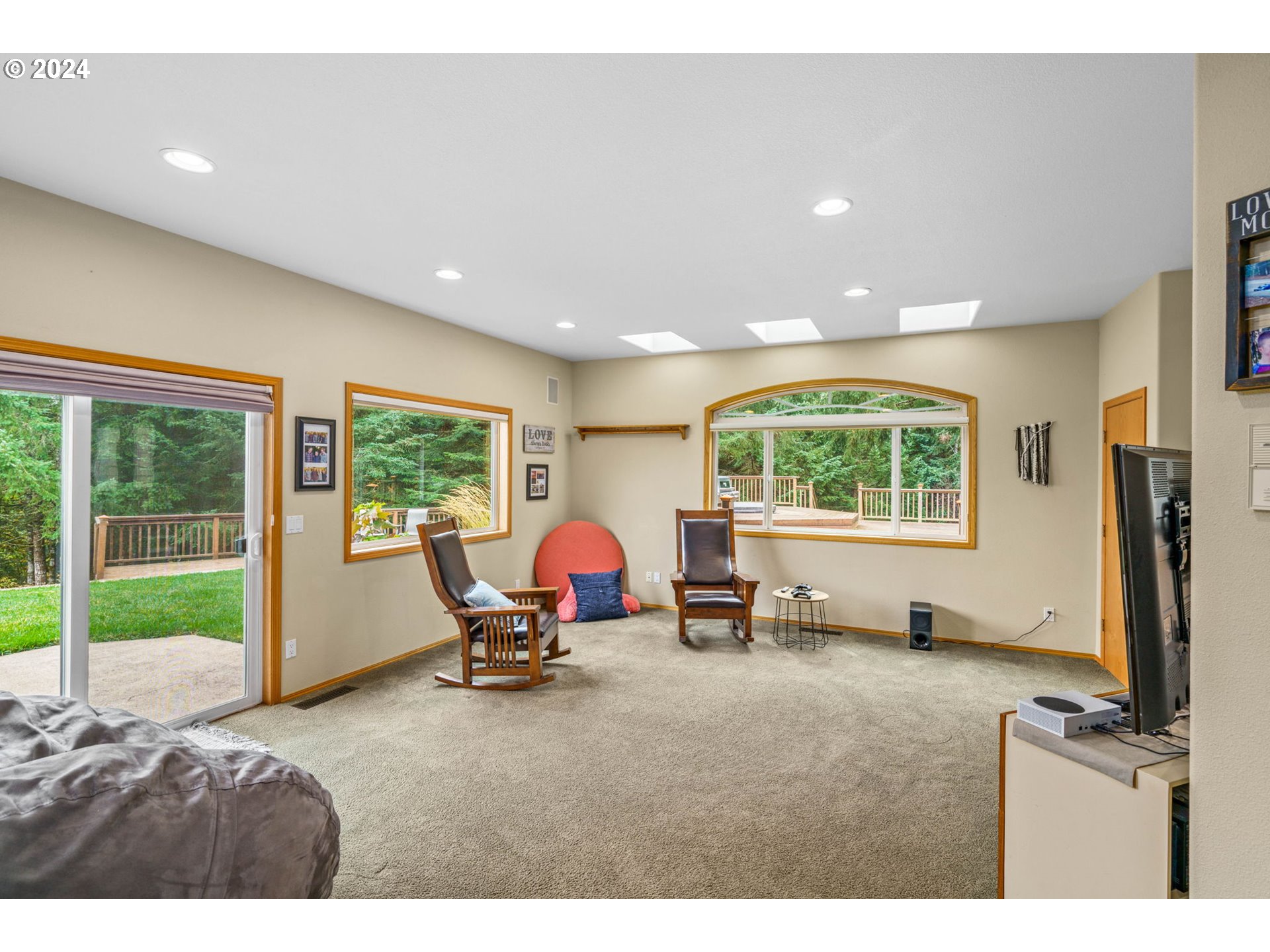 25241 Hall Road Cheshire, OR 97419 - Photo 16 of 48 a room with gym equipment and a large window