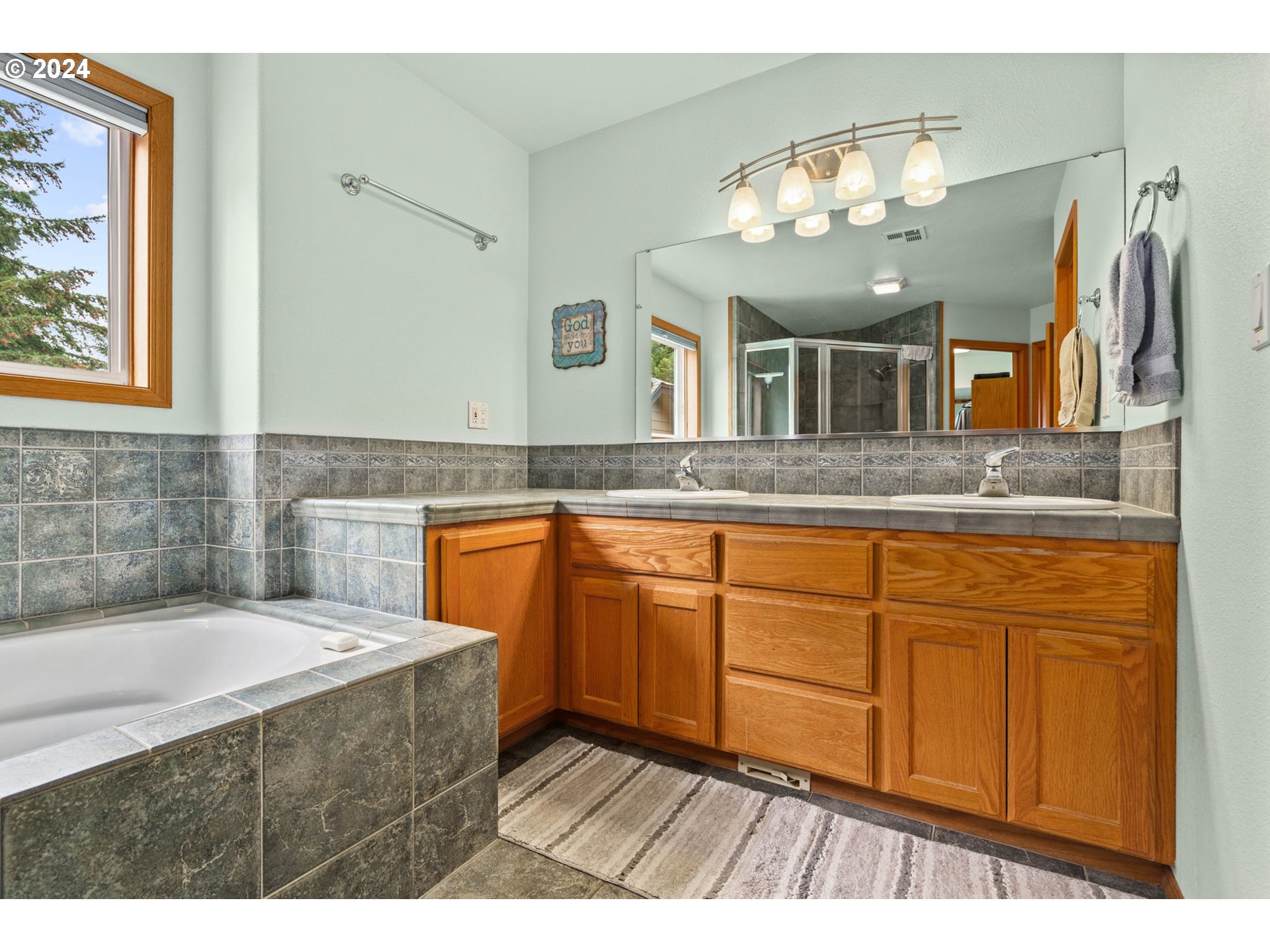 25241 Hall Road Cheshire, OR 97419 - Photo 24 of 48 a bathroom with a sink double vanity granite and a mirror