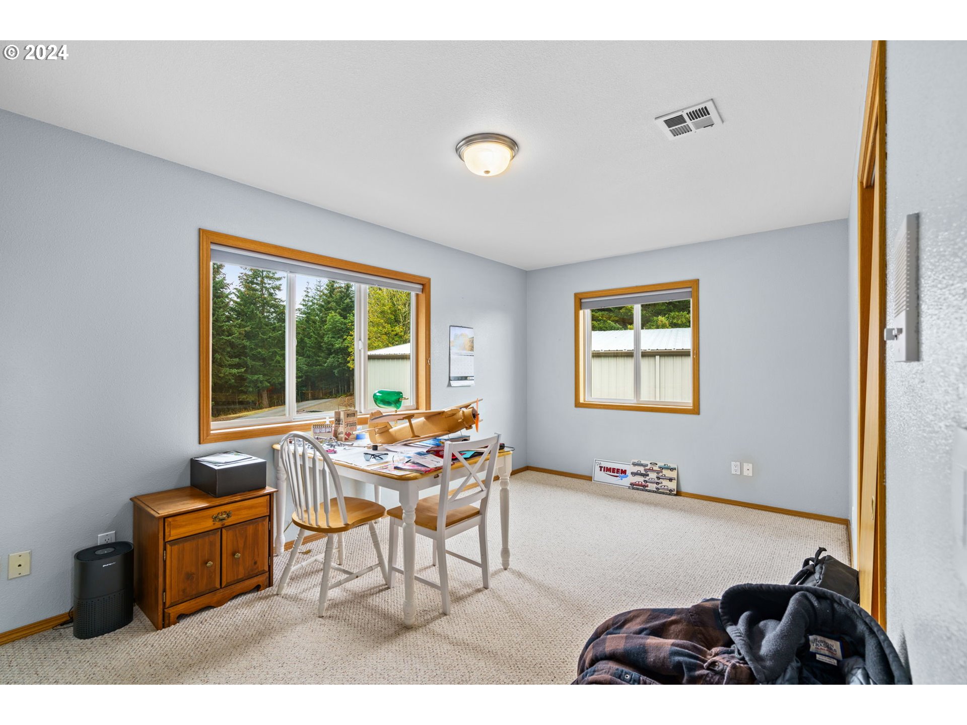25241 Hall Road Cheshire, OR 97419 - Photo 26 of 48 a living room with furniture and a window
