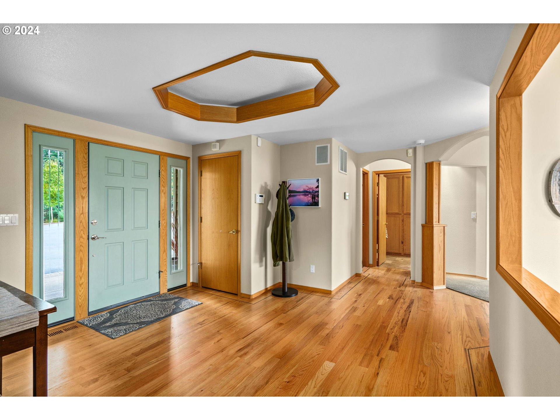 25241 Hall Road Cheshire, OR 97419 - Photo 3 of 48 a view of an empty room with wooden floor and a window