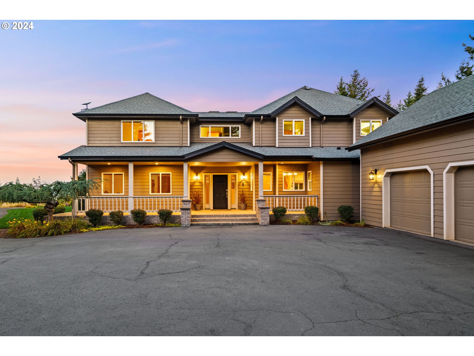 25241 Hall Road Cheshire, OR 97419 - Photo 33 of 48 a view of a brick house with many windows