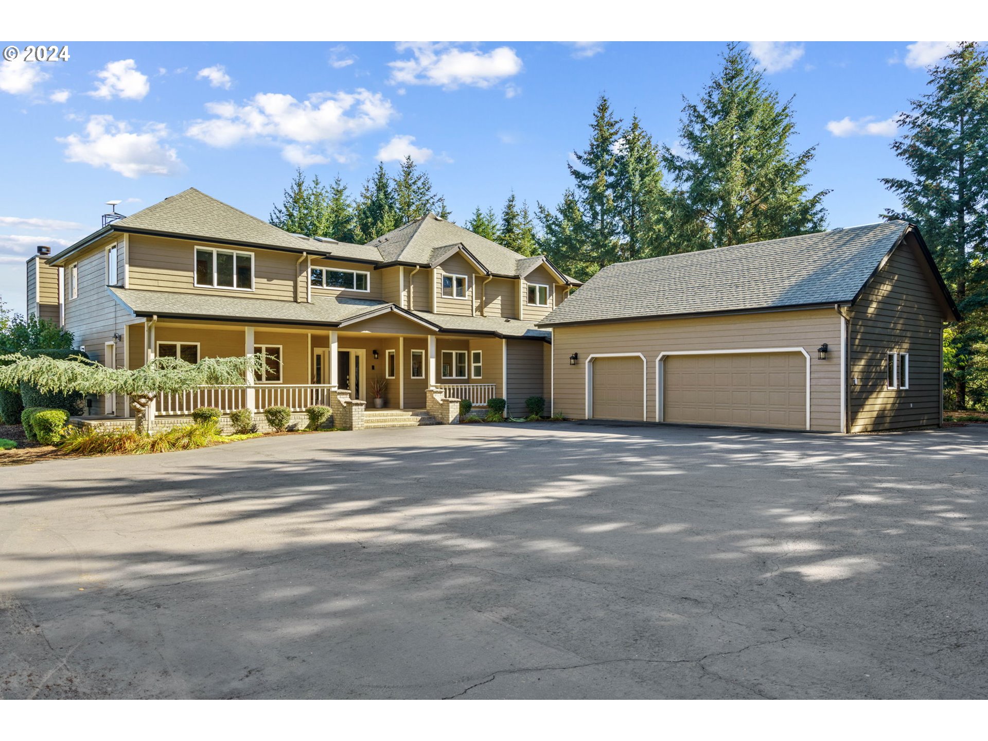 25241 Hall Road Cheshire, OR 97419 - Photo 34 of 48 a front view of a house with a yard and garage