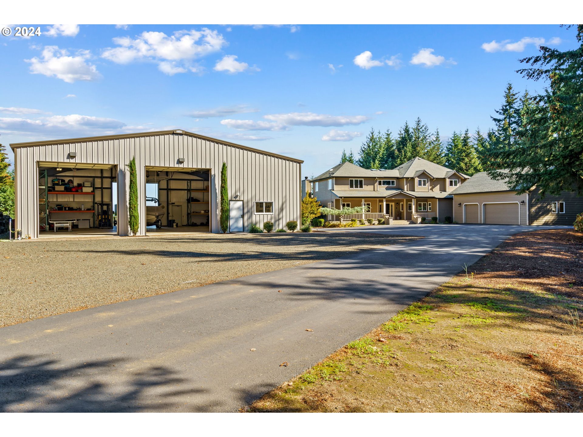 25241 Hall Road Cheshire, OR 97419 - Photo 35 of 48 a view of a house with a swimming pool