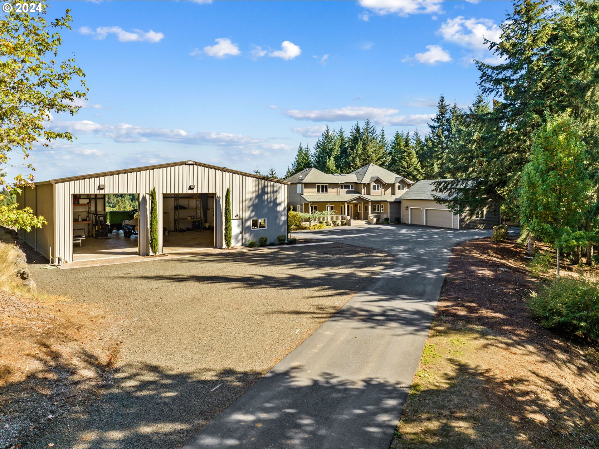 25241 Hall Road Cheshire, OR 97419 - Photo 44 of 48 a view of a house with swimming pool and sitting area