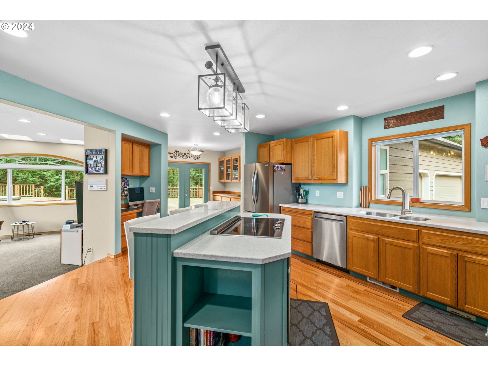 25241 Hall Road Cheshire, OR 97419 - Photo 6 of 48 a kitchen with kitchen island granite countertop a sink and stove