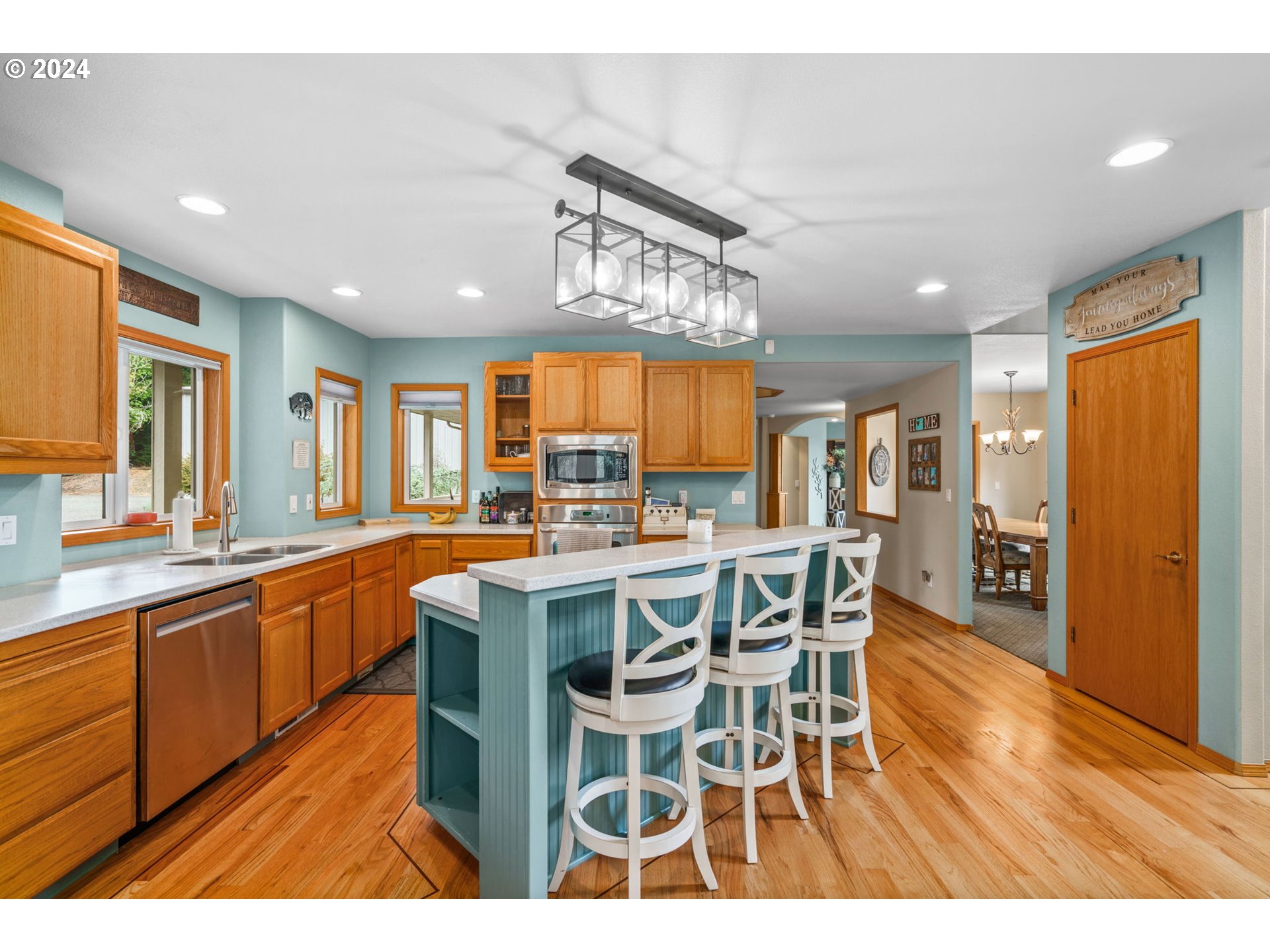 25241 Hall Road Cheshire, OR 97419 - Photo 7 of 48 a large kitchen with a table and chairs