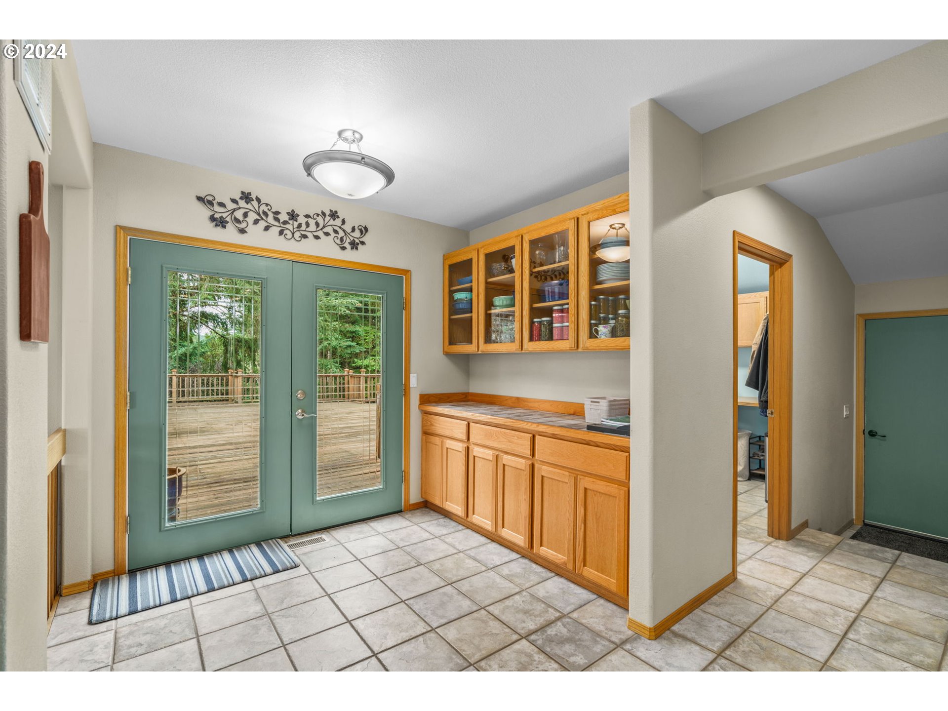 25241 Hall Road Cheshire, OR 97419 - Photo 8 of 48 a open kitchen with granite countertop a stove top oven a sink and cabinets