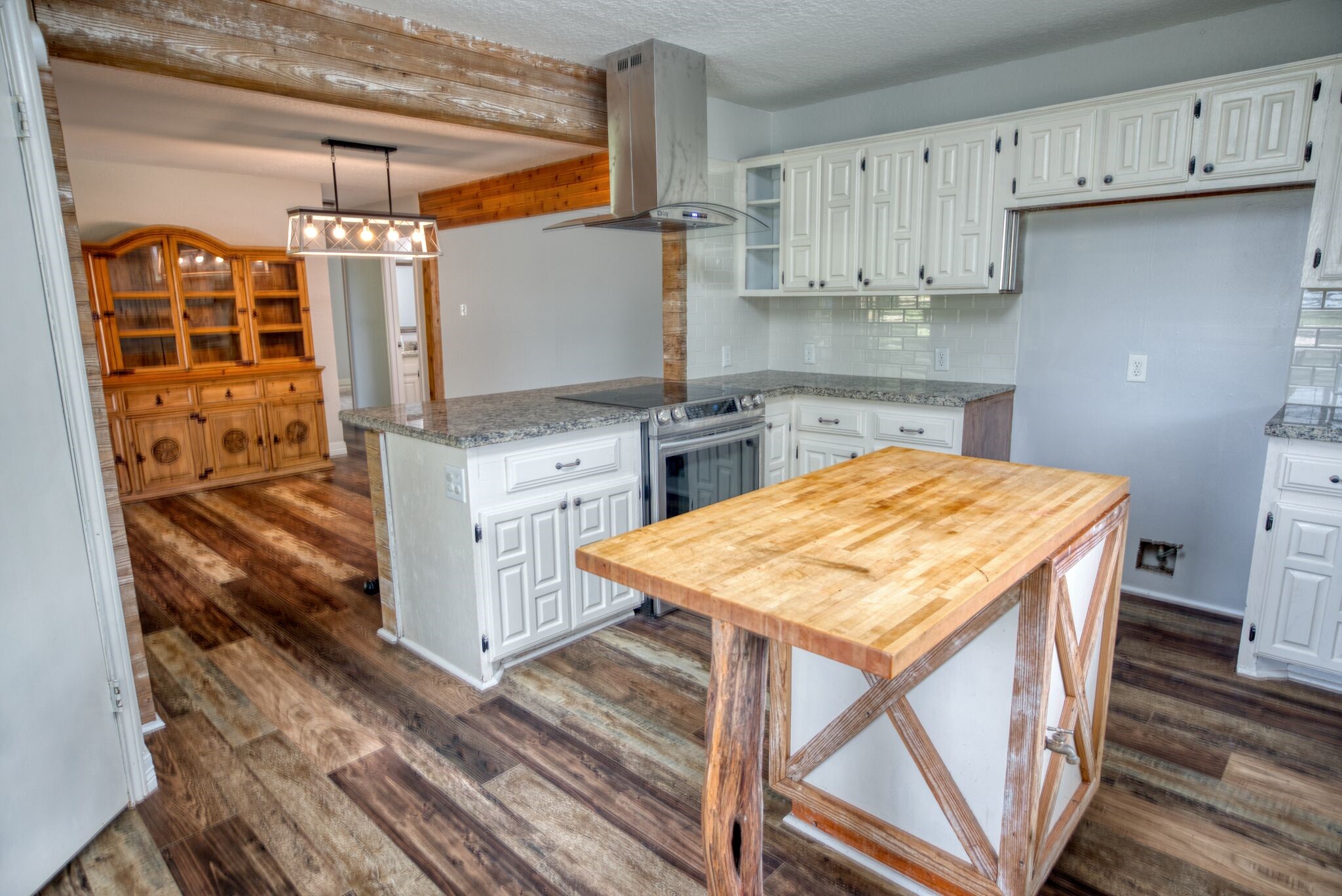 3836 Brazos River Road, Unit CR400 Freeport, TX 77541 - Photo 11 of 43 a kitchen with a stove a refrigerator and cabinets