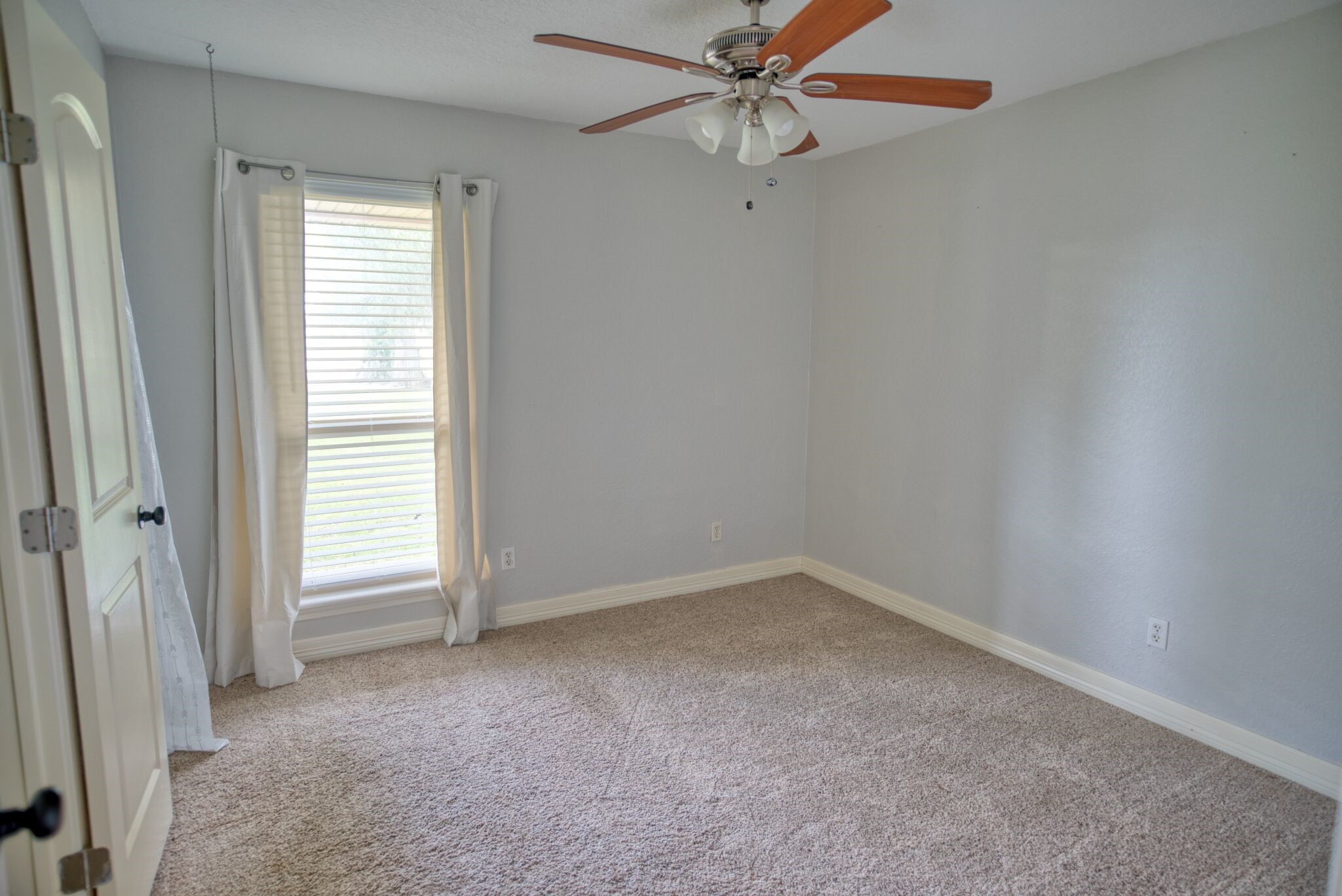 3836 Brazos River Road, Unit CR400 Freeport, TX 77541 - Photo 18 of 43 an empty room with windows and fan