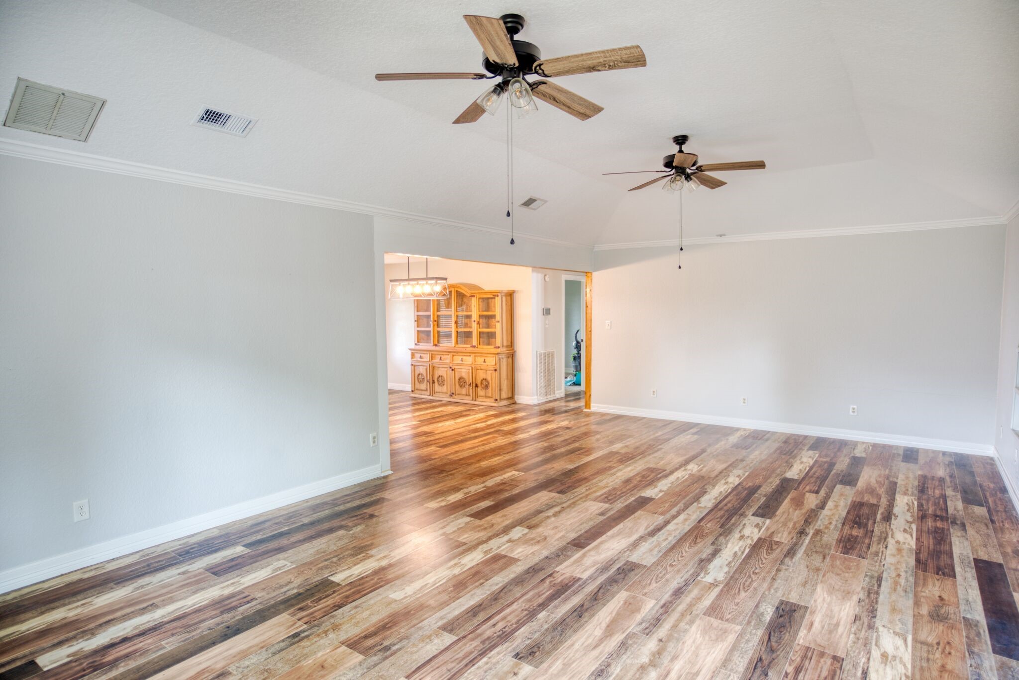 3836 Brazos River Road, Unit CR400 Freeport, TX 77541 - Photo 20 of 43 a view of empty room with wooden floor and fan