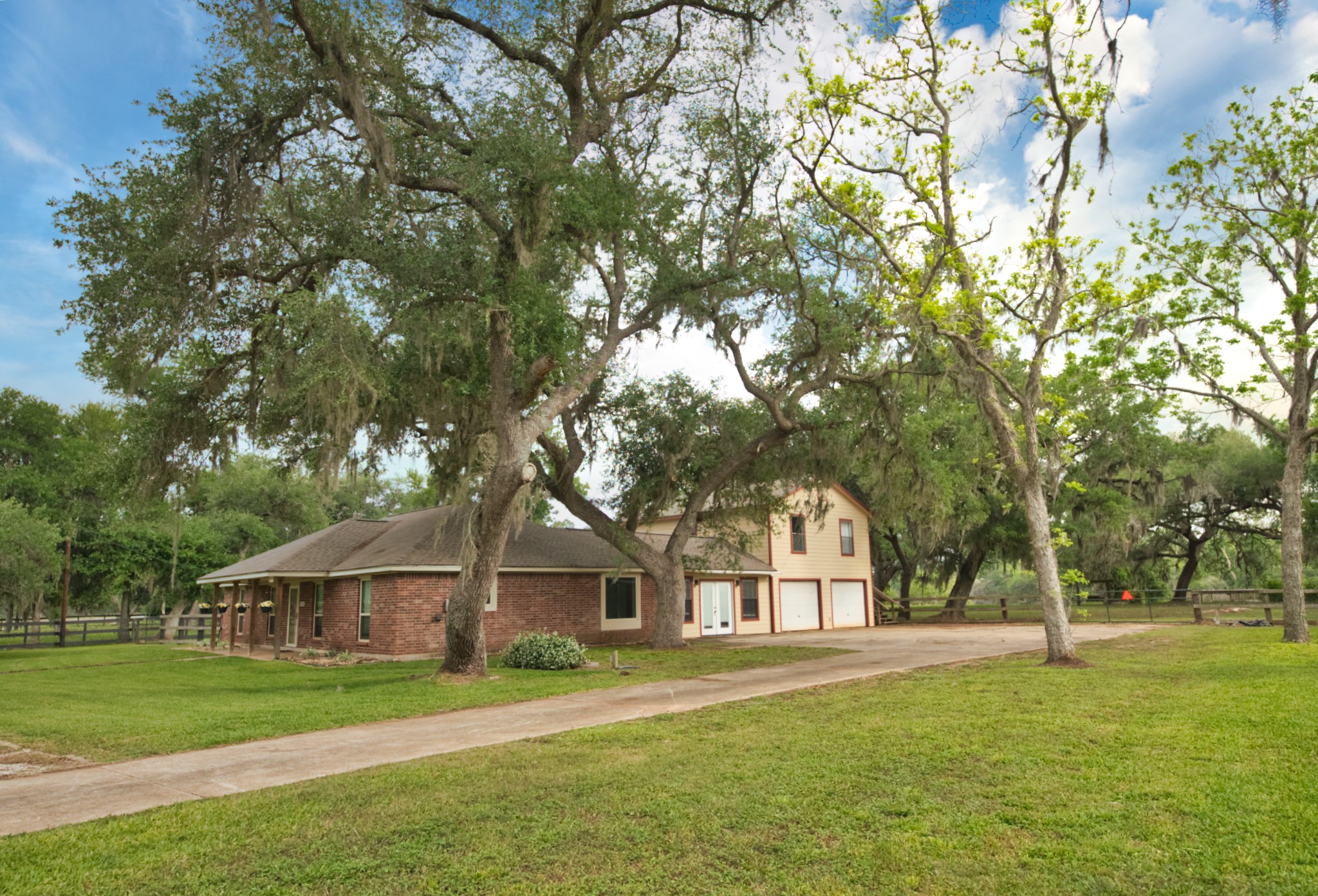 3836 Brazos River Road, Unit CR400 Freeport, TX 77541 - Photo 2 of 43 a front view of a house with a yard