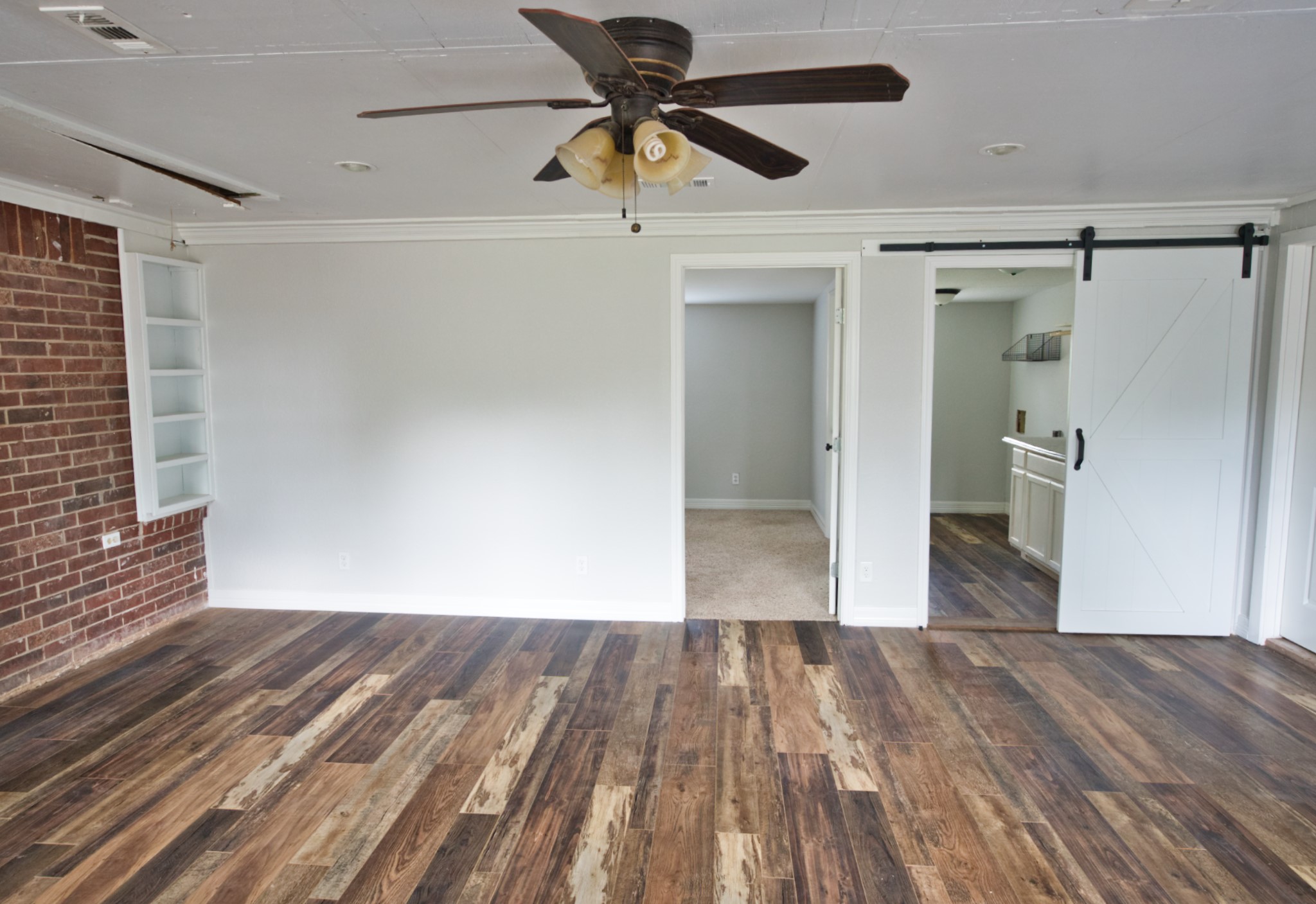 3836 Brazos River Road, Unit CR400 Freeport, TX 77541 - Photo 23 of 43 a view of empty room with wooden floor
