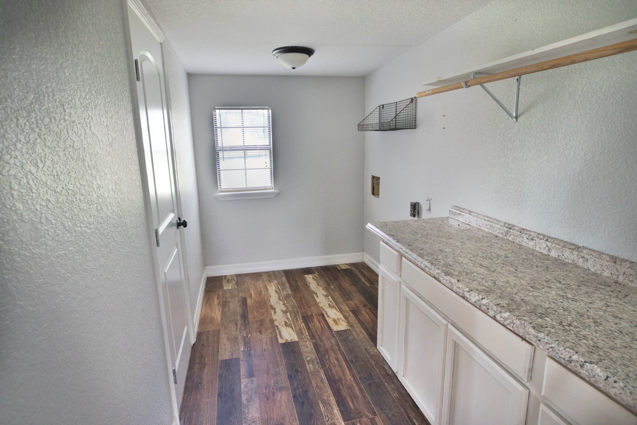 3836 Brazos River Road, Unit CR400 Freeport, TX 77541 - Photo 25 of 43 a view of a kitchen cabinets and wooden floor