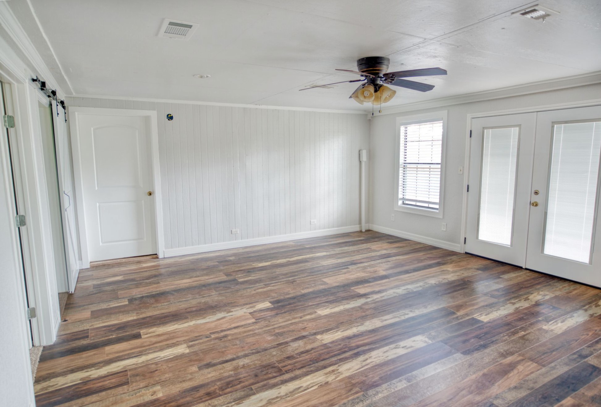 3836 Brazos River Road, Unit CR400 Freeport, TX 77541 - Photo 26 of 43 a view of an empty room with wooden floor and window