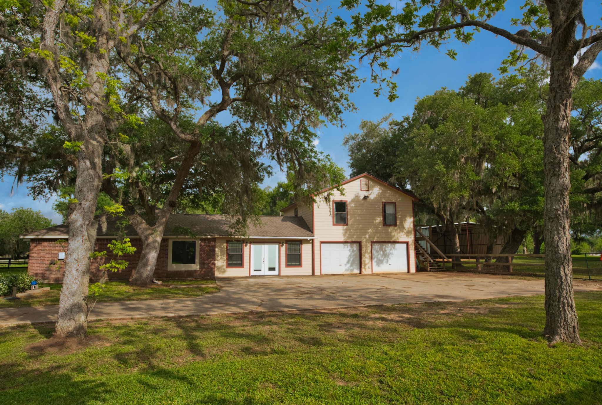 3836 Brazos River Road, Unit CR400 Freeport, TX 77541 - Photo 3 of 43 a front view of a house with a yard