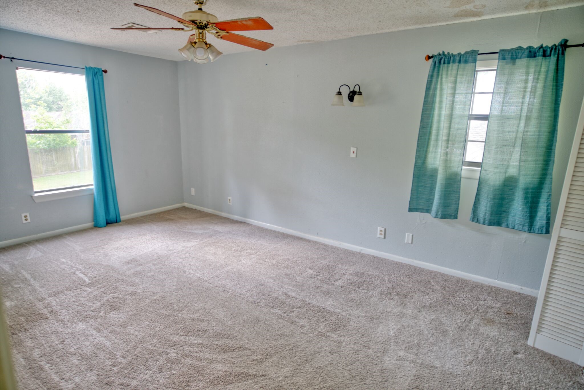 3836 Brazos River Road, Unit CR400 Freeport, TX 77541 - Photo 31 of 43 an empty room with windows and entrance