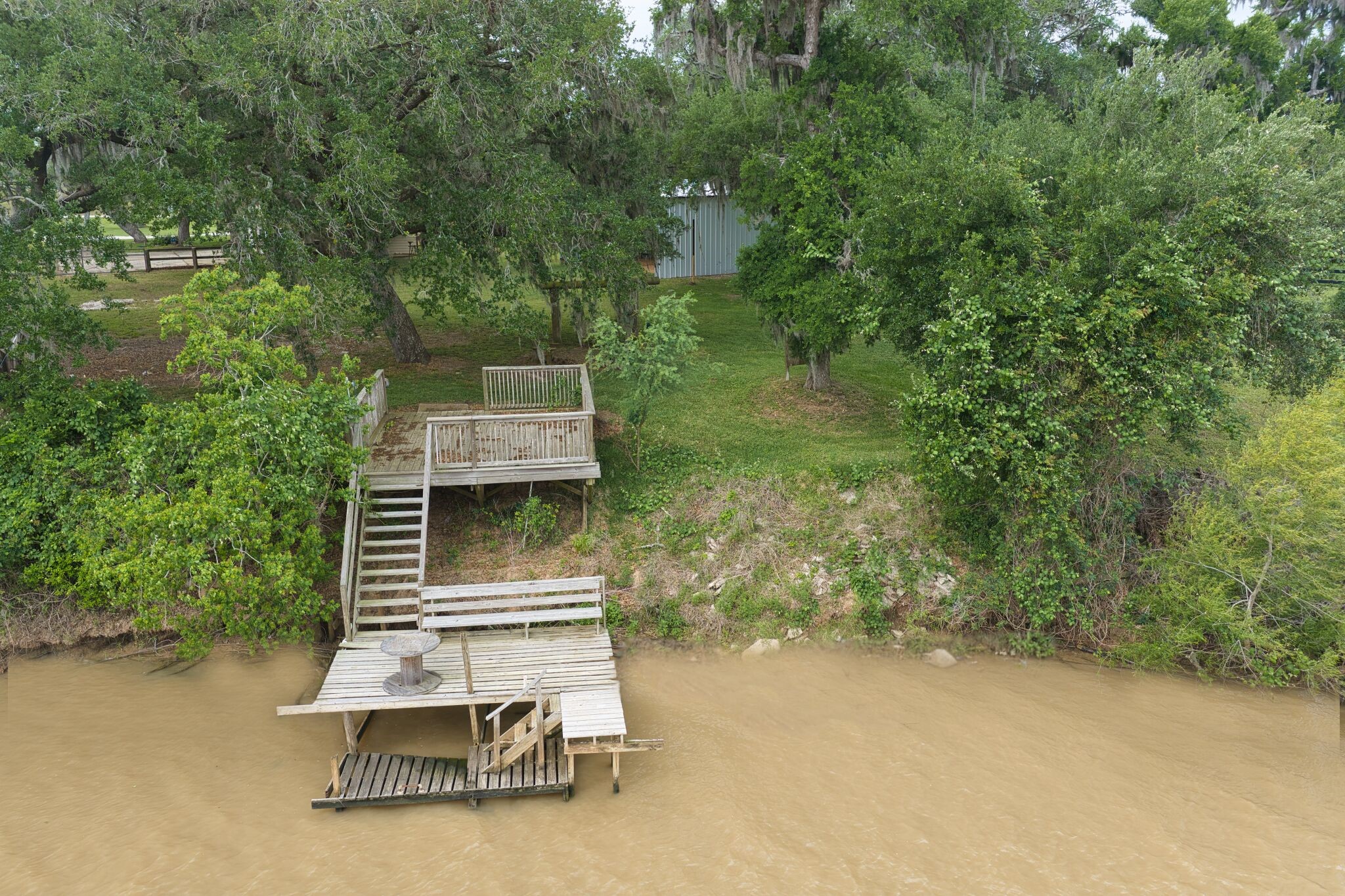 3836 Brazos River Road, Unit CR400 Freeport, TX 77541 - Photo 38 of 43 a small pool with a bench in the patio