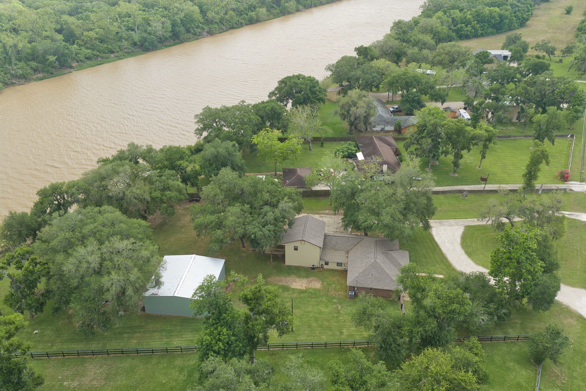 3836 Brazos River Road, Unit CR400 Freeport, TX 77541 - Photo 42 of 43 an aerial view of a house with outdoor space and street view