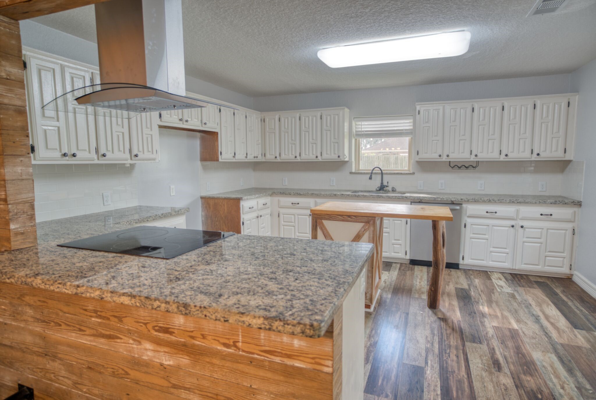 3836 Brazos River Road, Unit CR400 Freeport, TX 77541 - Photo 9 of 43 a kitchen with granite countertop a sink and cabinets