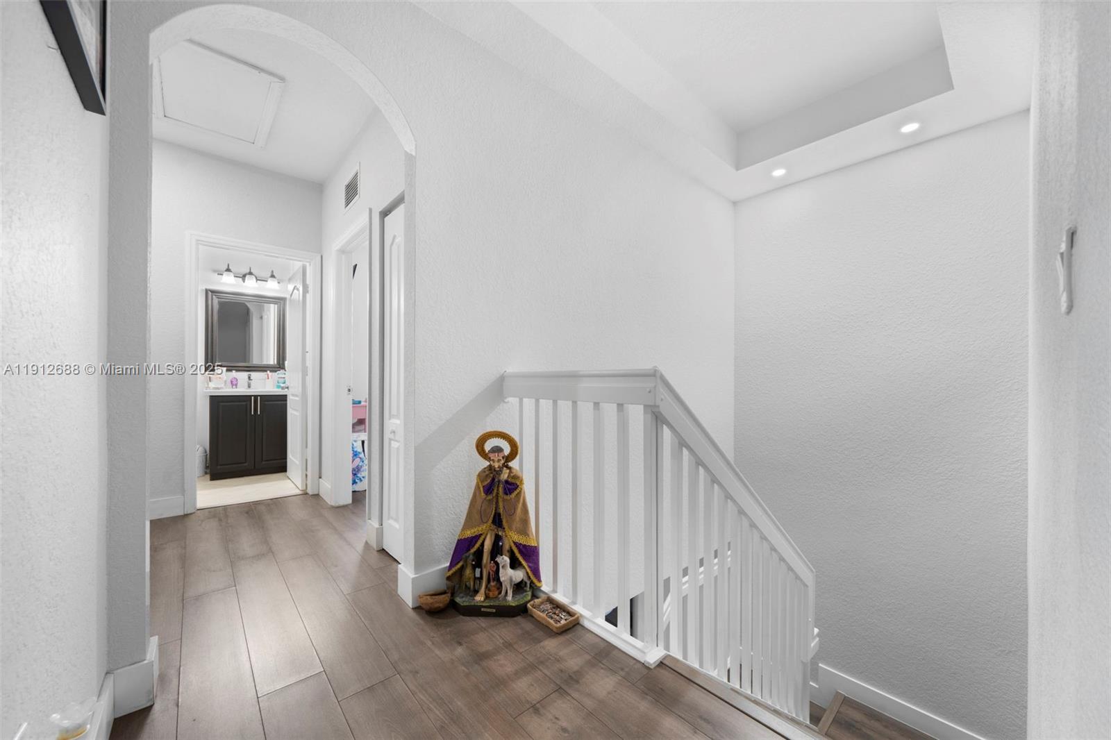 15245 Southwest 8th Way Miami, FL 33194 - Photo 15 of 25 a view of a livingroom with wooden floor and stairs