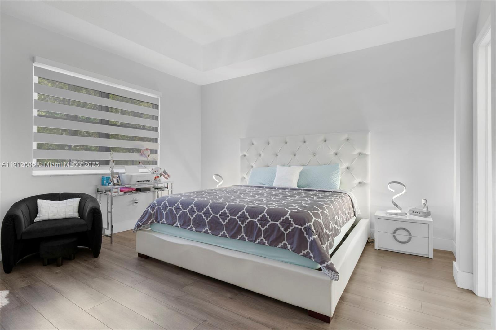 15245 Southwest 8th Way Miami, FL 33194 - Photo 16 of 25 a bedroom with a bed and a couch