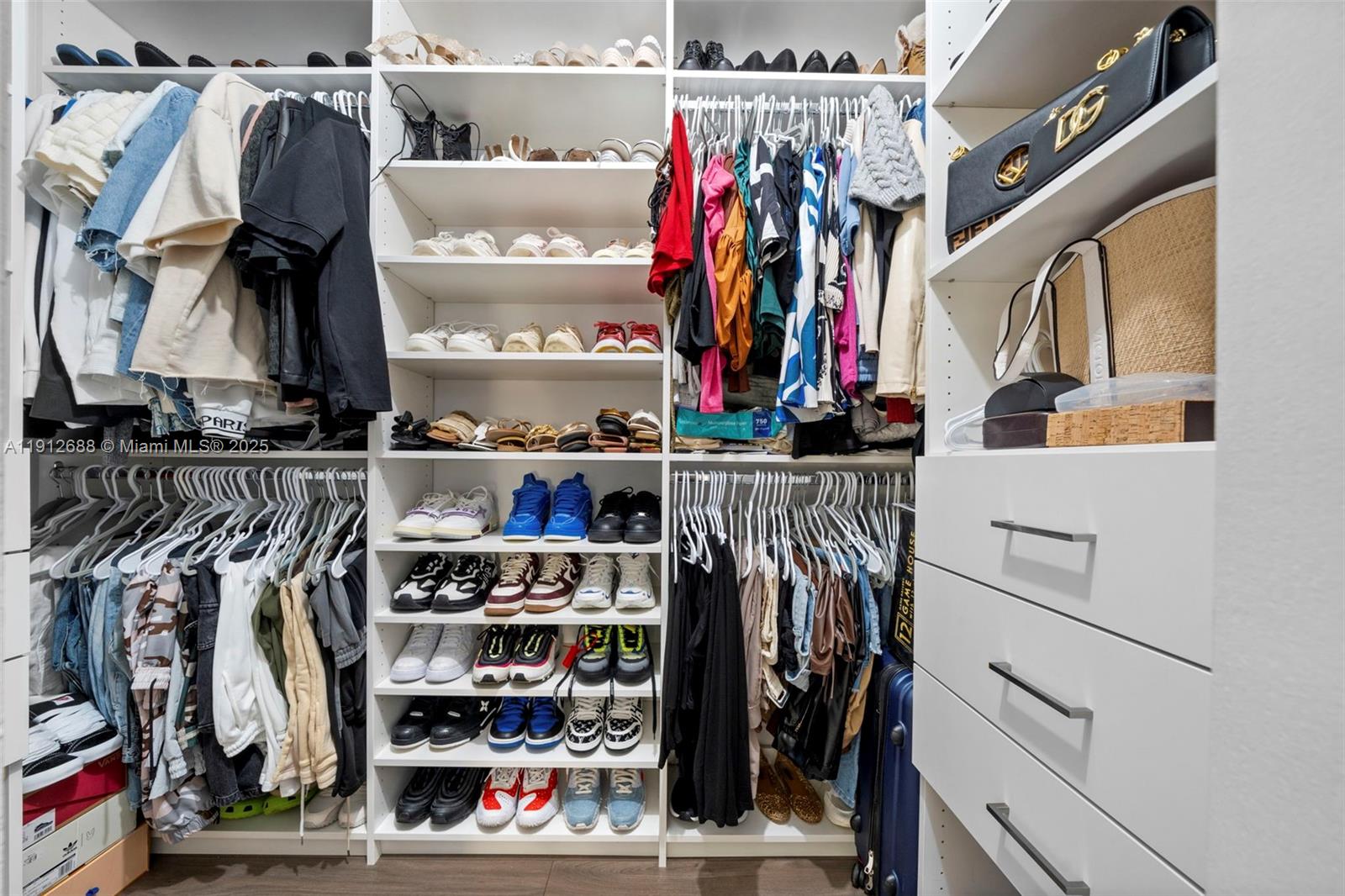 15245 Southwest 8th Way Miami, FL 33194 - Photo 20 of 25 a view of walk in closet with clothes