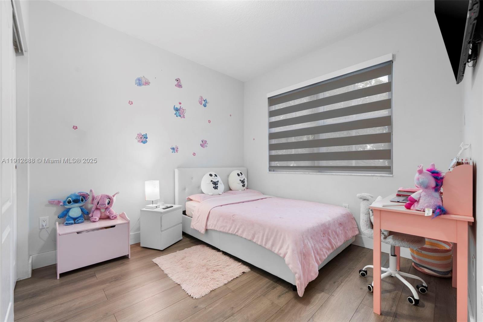 15245 Southwest 8th Way Miami, FL 33194 - Photo 21 of 25 a bedroom with a bed and wooden floor