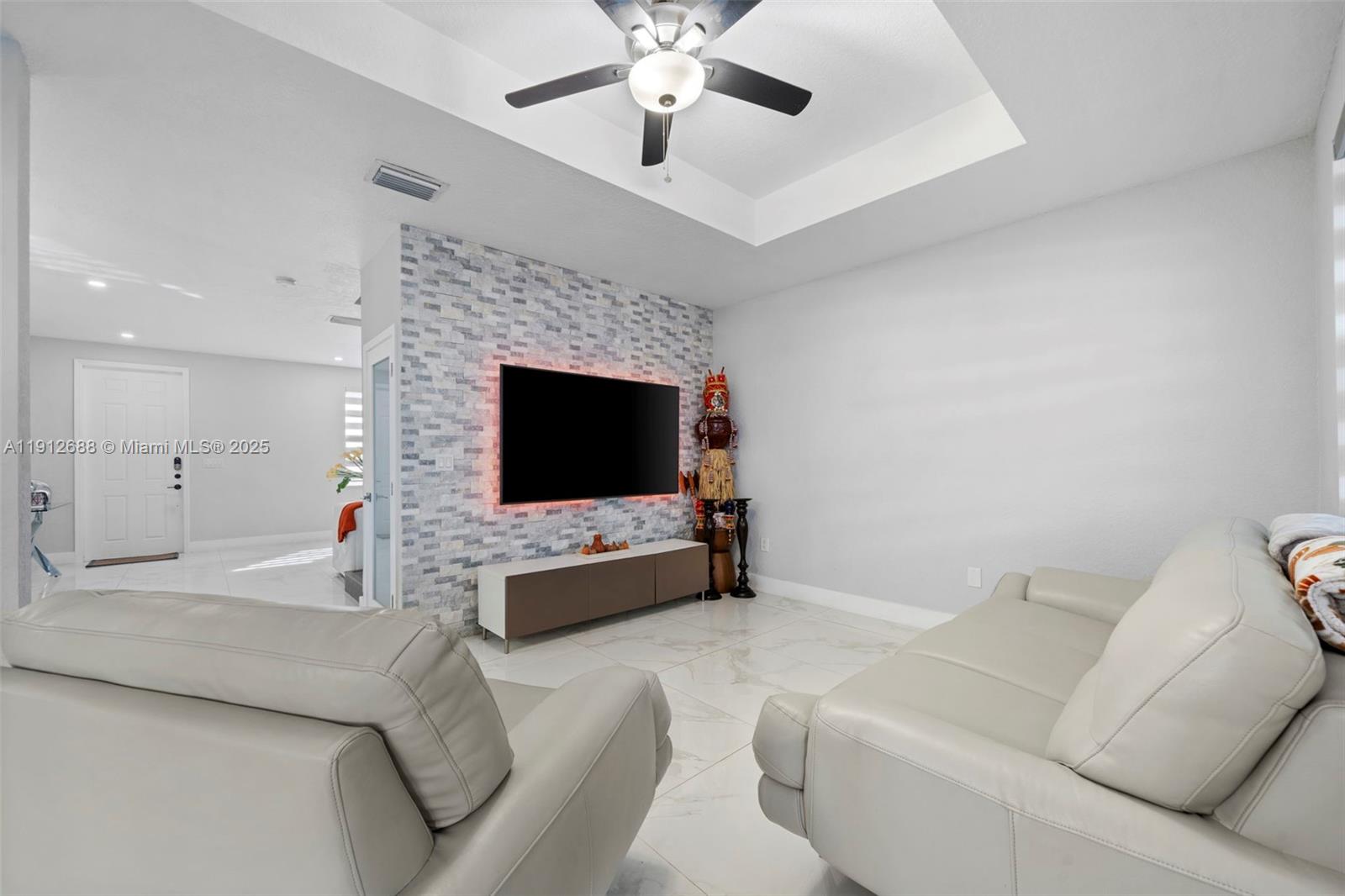 15245 Southwest 8th Way Miami, FL 33194 - Photo 8 of 25 a living room with furniture and a fireplace