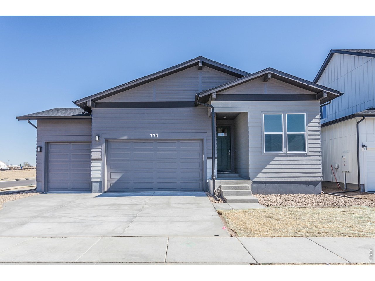 774 Trumpet Court Windsor, CO 80550 - Photo 4 of 49 a front view of a house