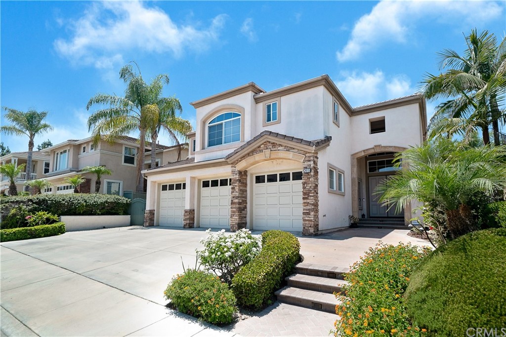 2615 Tuscany Way Fullerton, CA 92835 - Photo 1 of 1 a front view of a house with a garden