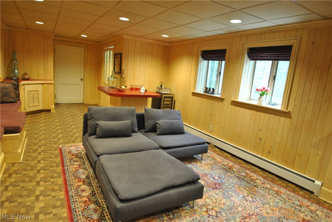 1984 Stockbridge Road Akron, OH 44313 - Photo 29 of 35 This club style rec room has paneled walls and recessed lighting and leads to the back staircase.