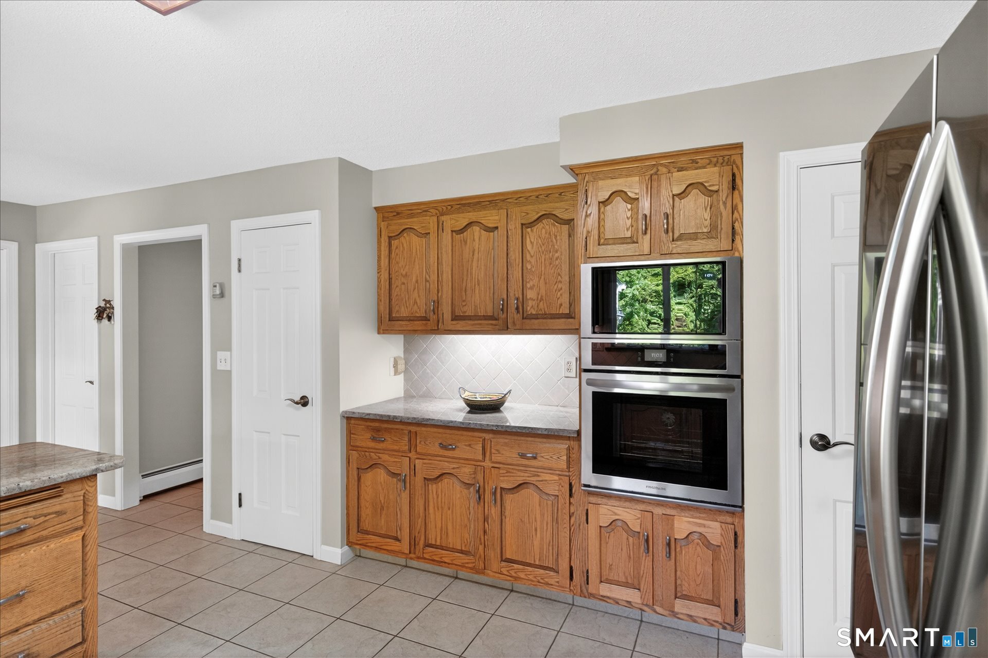 5 Shingle Mill Drive Canton, CT 06019 - Photo 12 of 38 a kitchen with stainless steel appliances granite countertop a refrigerator and a stove top oven