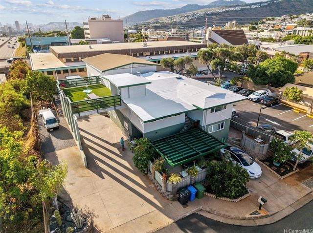 an aerial view of a house with outdoor space