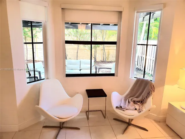 a living room with furniture and a window