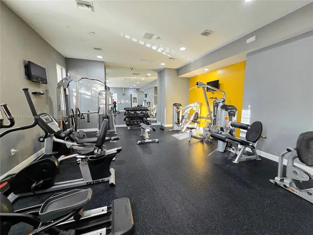 an empty room with wooden floor and a window