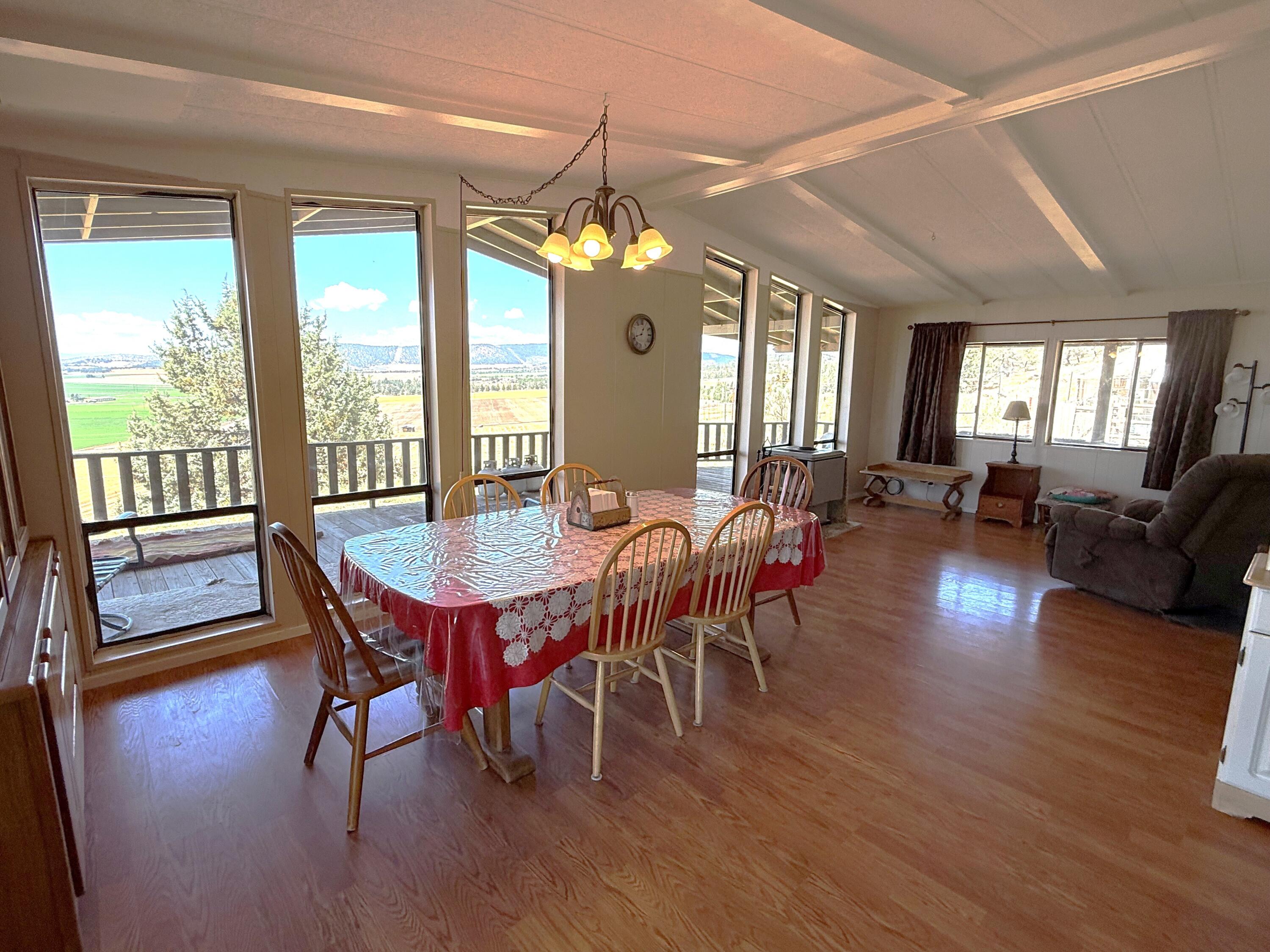 17550 Maupin Road Malin, OR 97632 - Photo 11 of 62 a view of a dining room with furniture window and wooden floor