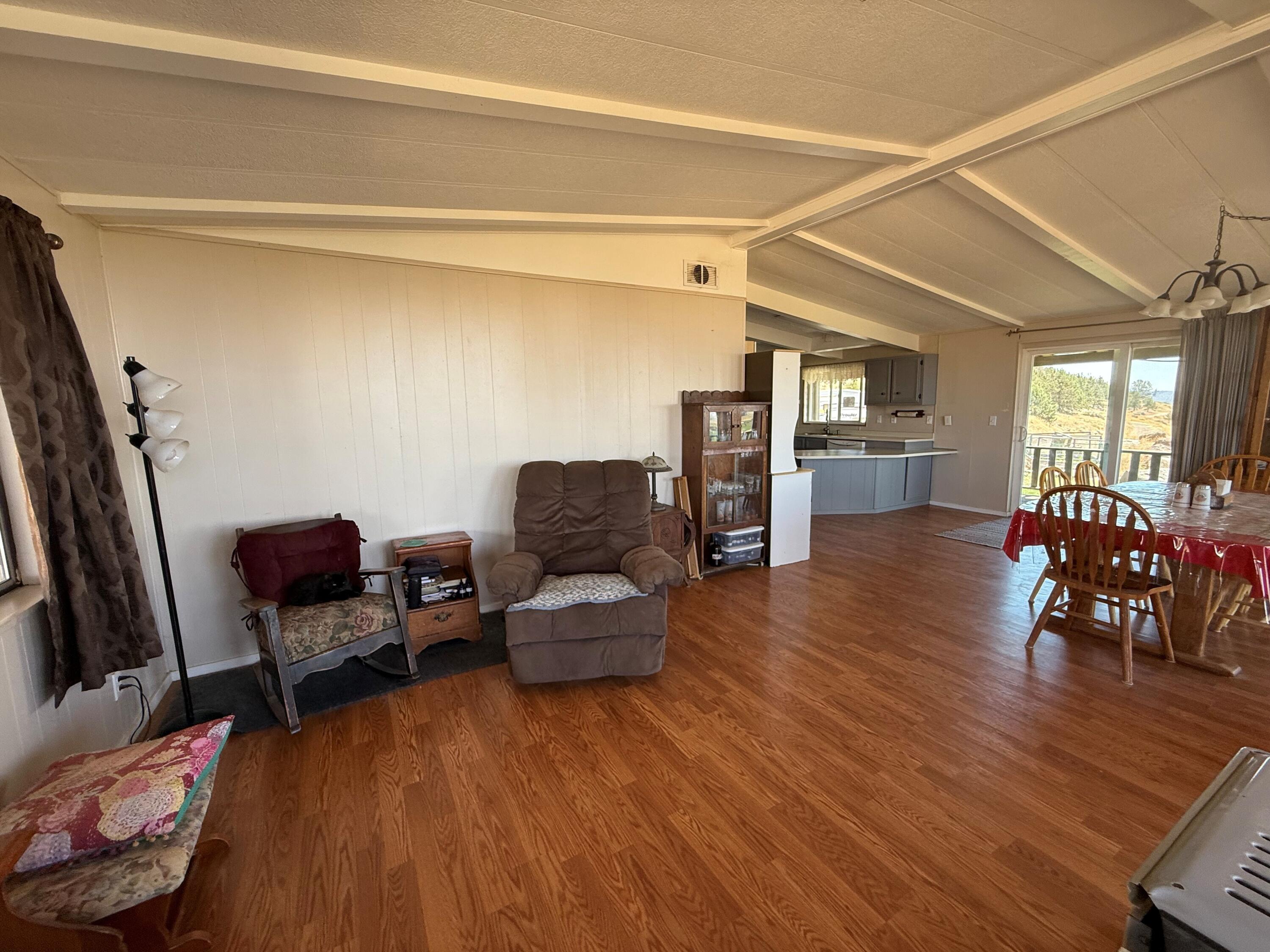 17550 Maupin Road Malin, OR 97632 - Photo 13 of 62 a living room with furniture and a wooden floor