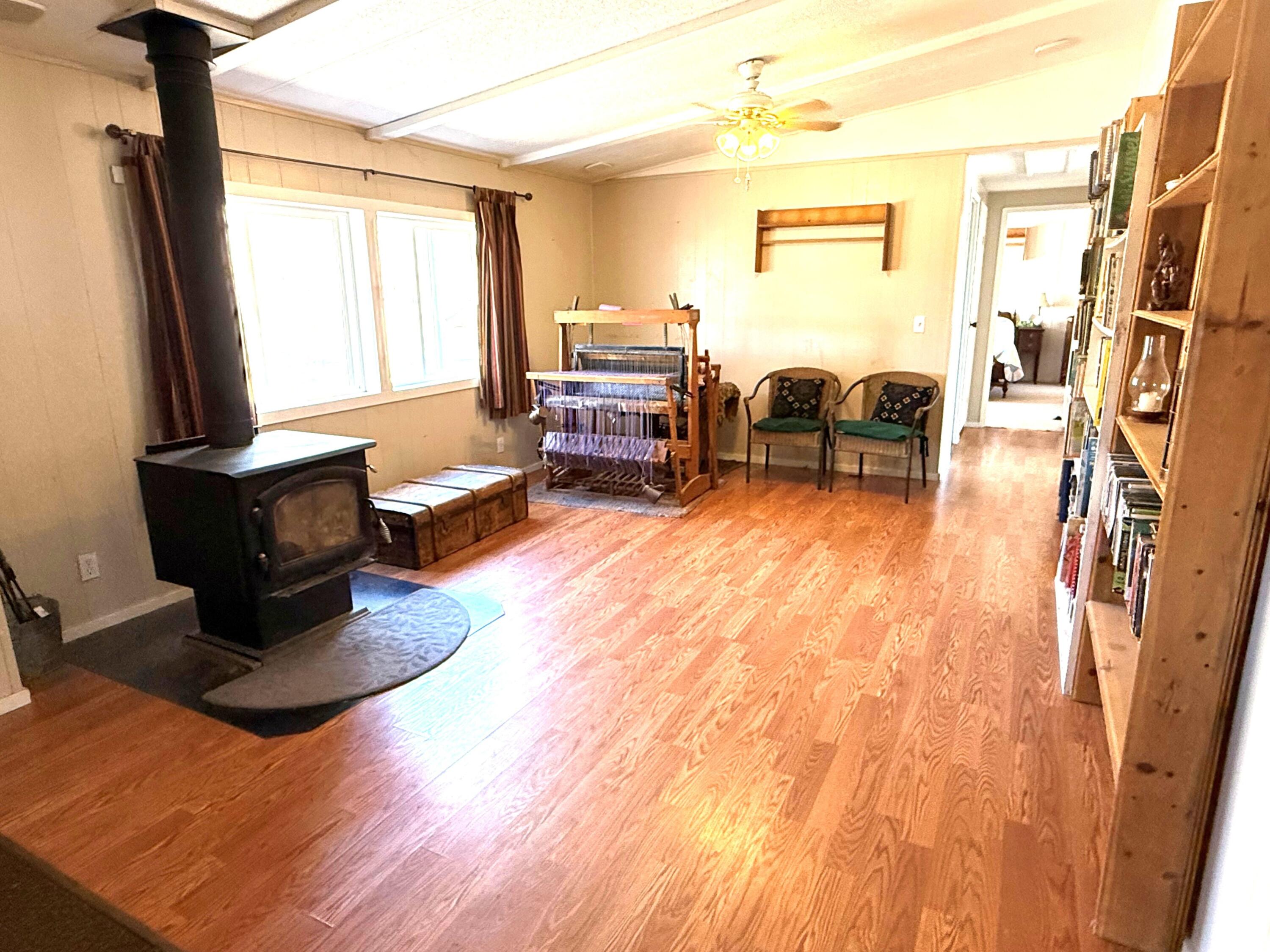 17550 Maupin Road Malin, OR 97632 - Photo 20 of 62 a living room with furniture fireplace and a flat screen tv