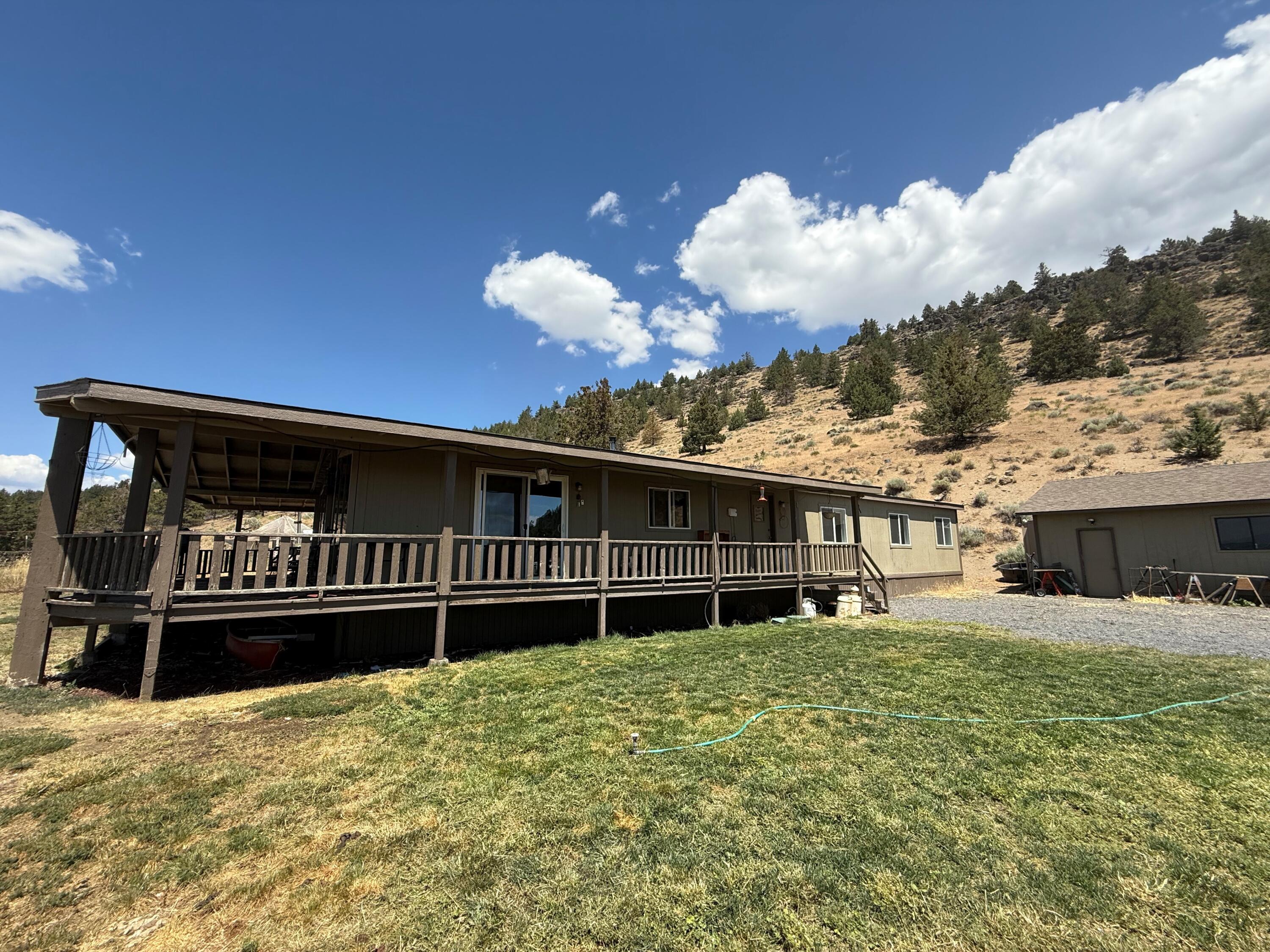 17550 Maupin Road Malin, OR 97632 - Photo 2 of 62 a view of a house with a wooden deck and a yard