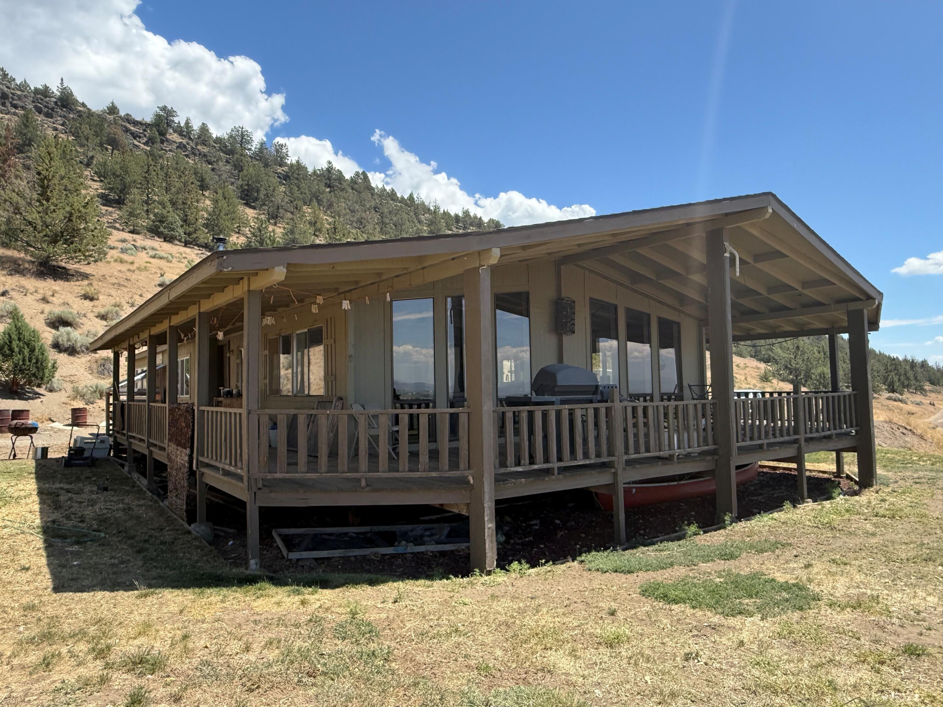 17550 Maupin Road Malin, OR 97632 - Photo 3 of 62 a view of a house with a yard and wooden deck