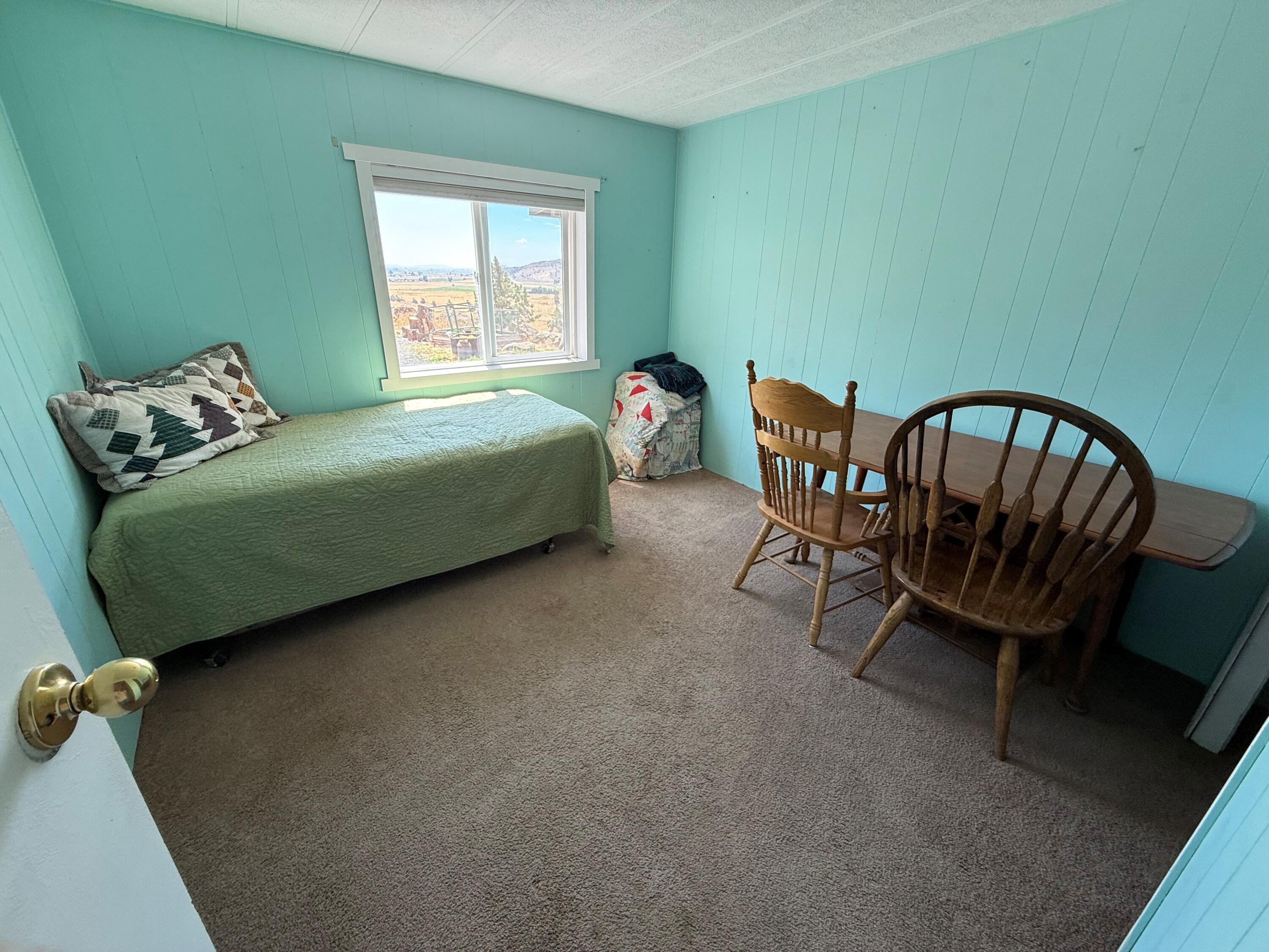 17550 Maupin Road Malin, OR 97632 - Photo 34 of 62 a bedroom with a bed chair and a window