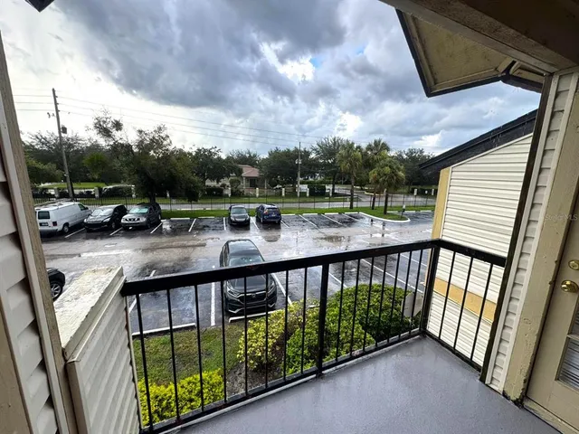 a view of balcony with furniture